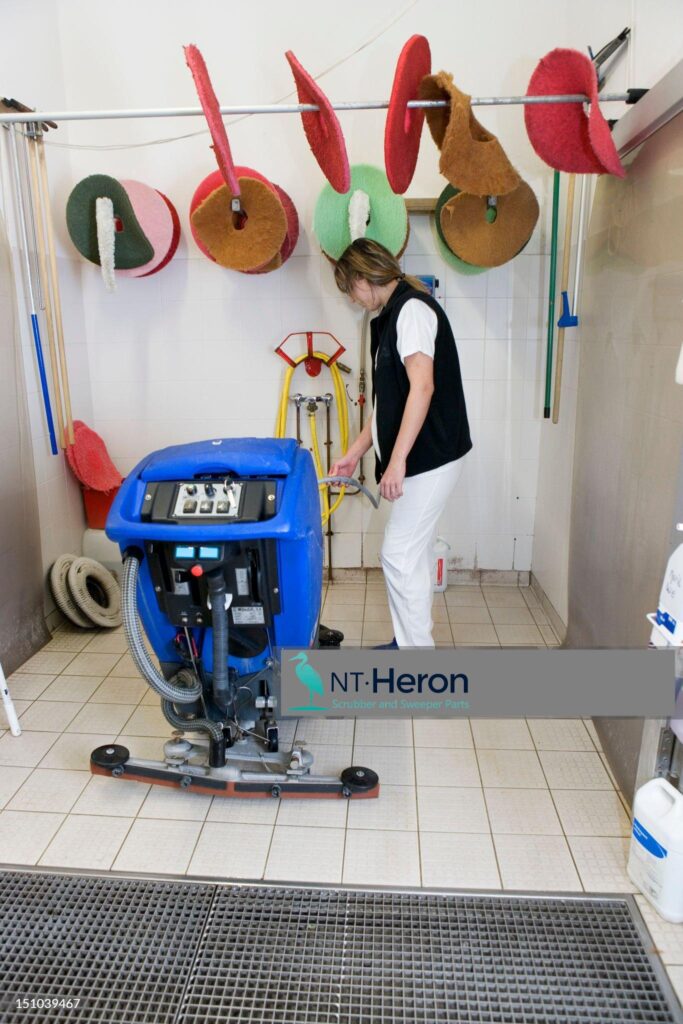 Durable floor scrubber accessories in action (squeegee blades and vacuum hoses)